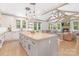 Gourmet kitchen, hardwood flooring, stainless steel appliances and open access to a vaulted-ceiling living area at 102 Antioch Plantation Dr # 18, Matthews, NC 28104