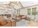 Open-concept living area with vaulted ceilings and hardwood flooring with a view of the gourmet kitchen at 102 Antioch Plantation Dr # 18, Matthews, NC 28104