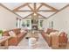 Vaulted-ceiling living room with fireplace, comfortable seating and hardwood flooring at 102 Antioch Plantation Dr # 18, Matthews, NC 28104
