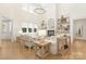 Bright living room with white furniture, fireplace, hardwood floors, and natural light at 102 Antioch Plantation Dr # 18, Matthews, NC 28104