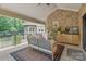 Relaxing covered patio with comfortable seating and a view of the well-manicured backyard at 102 Antioch Plantation Dr # 18, Matthews, NC 28104