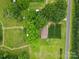 Aerial view of a home surrounded by lush greenery and trees, showcasing a peaceful, private setting at 1081 Long Dr, Newton, NC 28658