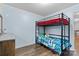 This bedroom features a sturdy bunk bed and great hardwood style flooring at 1081 Long Dr, Newton, NC 28658