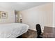Comfortable bedroom with hardwood floors, and a doorway leading to another room at 1081 Long Dr, Newton, NC 28658