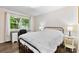 Cozy bedroom featuring hardwood floors, a large window, and a relaxing atmosphere at 1081 Long Dr, Newton, NC 28658