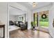 Welcoming foyer with hardwood floors, view into the living room, and bright natural light at 1081 Long Dr, Newton, NC 28658