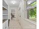 Hallway with a view to the outside and a doorway leading to another room at 1081 Long Dr, Newton, NC 28658