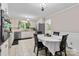 Charming kitchen featuring white cabinets, stainless steel appliances, and an adjacent dining area at 1081 Long Dr, Newton, NC 28658