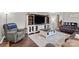 Well-lit living room with a modern entertainment center, comfortable seating, and elegant decor at 1081 Long Dr, Newton, NC 28658
