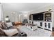 Spacious living room with a large entertainment center, cozy seating, and stylish decor at 1081 Long Dr, Newton, NC 28658
