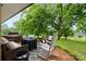 Cozy brick patio with outdoor furniture, grill, and peaceful view of the backyard at 1081 Long Dr, Newton, NC 28658