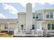 Outdoor patio with a grill and seating area overlooking the yard at 10945 Winterbourne Ct, Charlotte, NC 28277