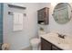 Updated bathroom features vanity, cabinet, and tile accents at 10945 Winterbourne Ct, Charlotte, NC 28277