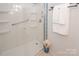 Bathroom shower with safety bar and tiled trim at 10945 Winterbourne Ct, Charlotte, NC 28277