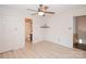 Bright bedroom featuring ceiling fan and doorway to bath at 10945 Winterbourne Ct, Charlotte, NC 28277