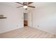 Bedroom featuring ceiling fan and an open doorway to stairs at 10945 Winterbourne Ct, Charlotte, NC 28277