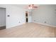 Bright bedroom with modern floors, a ceiling fan, natural light, and ample space at 10945 Winterbourne Ct, Charlotte, NC 28277
