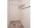 Walk in closet with tile floor and shelf at 10945 Winterbourne Ct, Charlotte, NC 28277