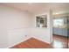 Dining room with hardwood floors and open view to the kitchen and light-colored cabinets at 10945 Winterbourne Ct, Charlotte, NC 28277