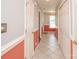 Bright hallway with tiled floors, featuring painted walls and traditional trim at 10945 Winterbourne Ct, Charlotte, NC 28277