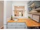 Kitchen with wood countertops, stainless appliances and view into living room at 10945 Winterbourne Ct, Charlotte, NC 28277