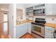 Cozy kitchen with stainless steel appliances and butcher block countertops at 10945 Winterbourne Ct, Charlotte, NC 28277