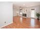 Bright living room featuring hardwood floors, fireplace, and ceiling fan, perfect for relaxation and entertaining at 10945 Winterbourne Ct, Charlotte, NC 28277
