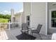 Spacious patio with outdoor seating, grill, and view of the lush backyard at 10945 Winterbourne Ct, Charlotte, NC 28277