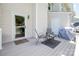 Cozy outdoor patio featuring a grill, seating, and a serene backyard view at 10945 Winterbourne Ct, Charlotte, NC 28277