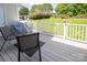 Relaxing backyard patio with grill and outdoor seating overlooking green lawn at 10945 Winterbourne Ct, Charlotte, NC 28277