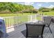 Backyard patio area featuring outdoor seating and overlooking green lawn at 10945 Winterbourne Ct, Charlotte, NC 28277