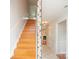 Staircase with wood steps, a tiled accent wall, and views to hallway at 10945 Winterbourne Ct, Charlotte, NC 28277