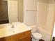 A well-lit bathroom features a neutral interior with a bathtub-shower and nice vanity at 11107 Lions Mane St, Charlotte, NC 28273
