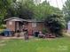 Modest brick single story with mature trees in the front yard at 1210 Grady St, Salisbury, NC 28144