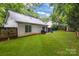 Spacious fenced backyard with lush green lawn and ample space for outdoor activities at 124 Cedarcroft Dr, Mooresville, NC 28115