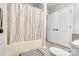 Practical bathroom with a combined shower and tub, tiled floor, and storage at 124 Cedarcroft Dr, Mooresville, NC 28115