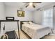 Cozy bedroom with a comfortable bed, neutral tones, and natural light from the window at 124 Cedarcroft Dr, Mooresville, NC 28115