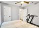 Well-lit bedroom featuring a bed, and a nearby doorway leading to another part of the house at 124 Cedarcroft Dr, Mooresville, NC 28115