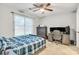 Bedroom featuring a blue comforter on a bed, along with an open window and computer desk at 124 Cedarcroft Dr, Mooresville, NC 28115