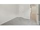 A neutrally decorated bedroom with wall-to-wall carpeting and a view to an adjacent room at 124 Utility Ln # E, Mooresville, NC 28117