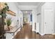 Inviting entryway with hardwood floors and neutral paint, flowing into the living spaces of the home at 12637 Belmont Mansion Dr, Charlotte, NC 28273