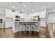 Bright and modern kitchen features a large island with seating and stainless steel appliances at 12637 Belmont Mansion Dr, Charlotte, NC 28273