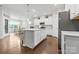 Spacious kitchen features a large center island, stainless steel appliances, and a dining area at 12637 Belmont Mansion Dr, Charlotte, NC 28273