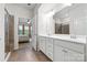 Main bathroom featuring double sink vanity, and glass shower, with access to the main bedroom at 12637 Belmont Mansion Dr, Charlotte, NC 28273