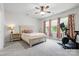 Spacious main bedroom with a ceiling fan, exercise equipment, and windows for plenty of natural light at 12637 Belmont Mansion Dr, Charlotte, NC 28273