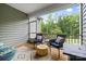 Relaxing screened porch with cozy seating and views of the lush, green backyard at 12637 Belmont Mansion Dr, Charlotte, NC 28273