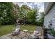 Landscaped backyard with patio, a gazebo, and mature shade trees at 12719 Walking Stick Dr, Charlotte, NC 28278
