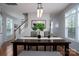 Open dining area with hardwood floors and modern lighting at 12719 Walking Stick Dr, Charlotte, NC 28278