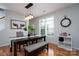 Open dining area with hardwood floors and modern lighting at 12719 Walking Stick Dr, Charlotte, NC 28278