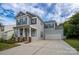 Charming two-story home with a welcoming front porch and a spacious two-car garage at 12719 Walking Stick Dr, Charlotte, NC 28278